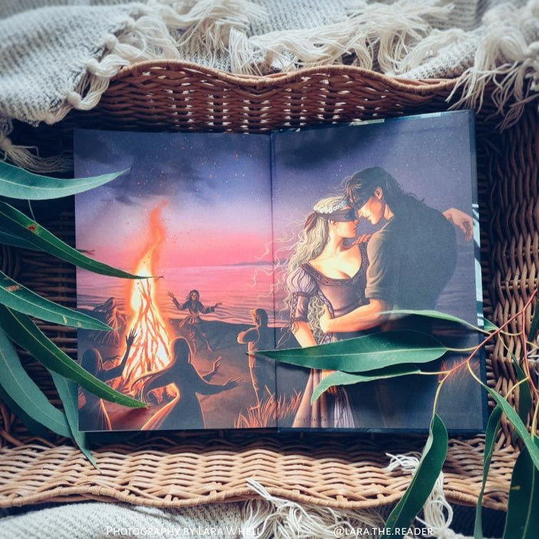 Scarlight special edition open book showing illustrated interior scene with romantic fantasy artwork